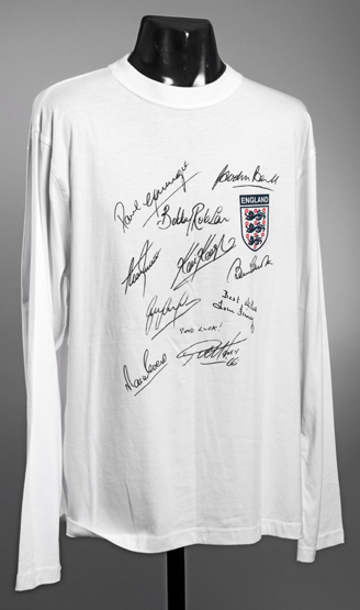 An autographed England legends shirt,
a white supporter's shirt,