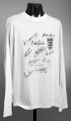 An autographed England legends shirt,
a white supporter's shirt,