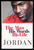 A Michael Jordan signed book,
Jordan, The Man, His Words, His Life, by Mitchell Krugel,