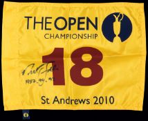 A souvenir 2010 Open Championship St Andrews 18th hole pin flag signed by three-times winner Nick