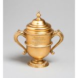 The 1928 Imperial Cup,
a silver-gilt trophy cup & cover, hallmarked D & J Wellby Ltd.