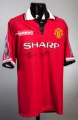 A Manchester United 1999 Champions League Final commemorative jersey signed by the goalscorers