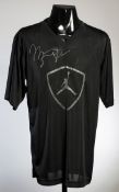 A Michael Jordan signed black basketball vest,
Michael Jordan branded logo,
