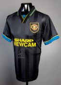 A replica Manchester United 'Kung Fu' shirt signed by Eric Cantona,