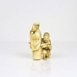 A finely carved Japanese ivory okimono,