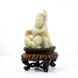 A Chinese celadon jade figural group, 19