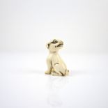 A Japanese ivory netsuke of a dog, 20th