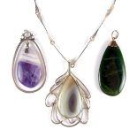 Collection of three jade and quartz pendants.