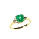 18 ct yellow gold emerald and diamond ring. The square cut faceted emerald weighing approx. 1.