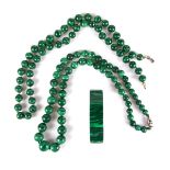 Two malachite bead necklaces and a malachite bracelet.