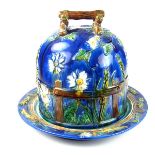 A Minton style majolica Stilton cheese dish and cover, late 19th/early 20th century.