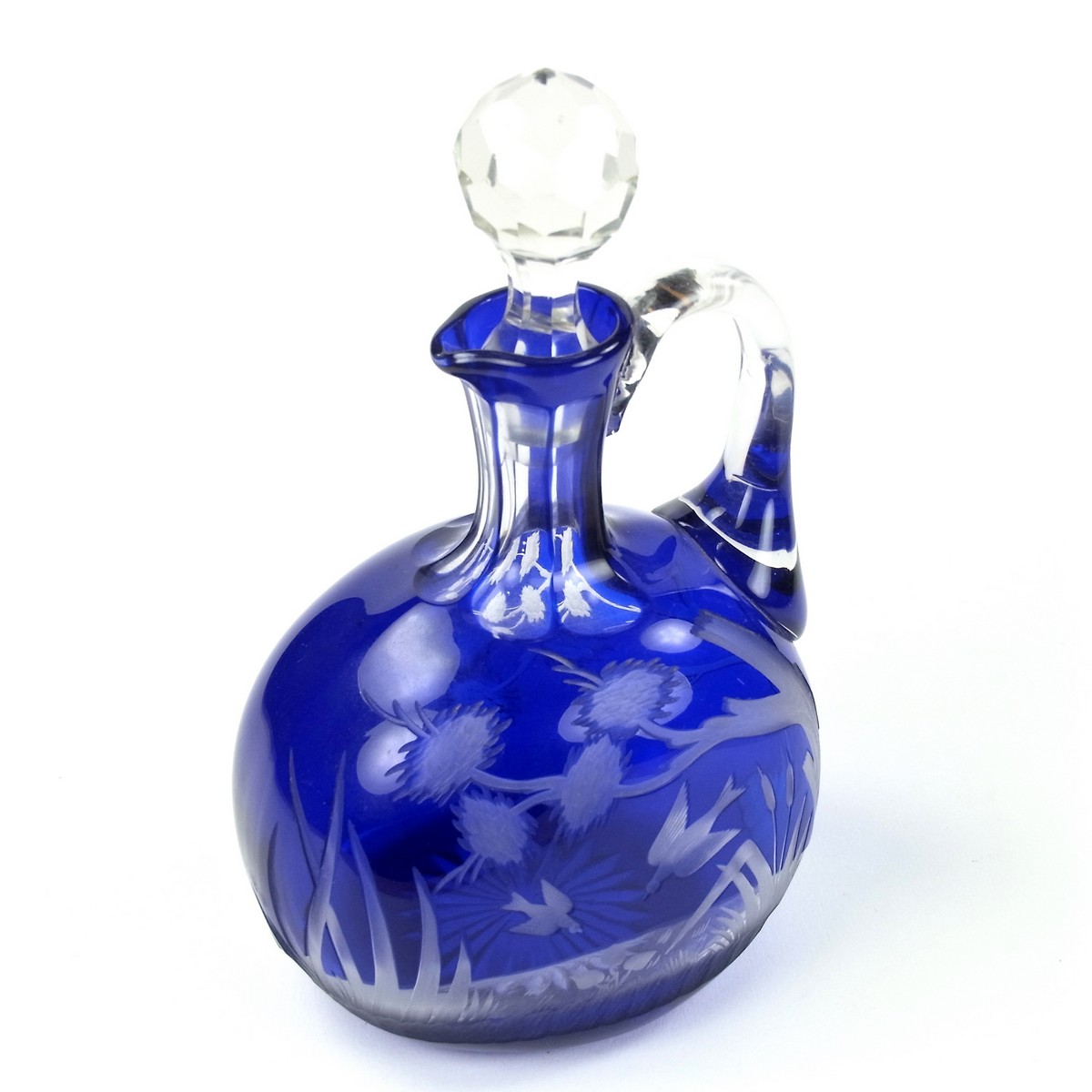 A Victorian engraved Bristol blue glass decanter.