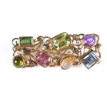 Yellow gold multi gem brooch, tests 18 ct.