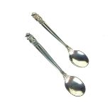 A pair of Georg Jenson salt spoons.