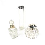 A group of three silver topped perfume bottles, early 20th century.