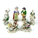 A group of seven German porcelain figurines.