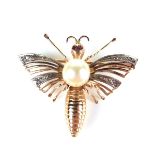 Yellow gold diamond, ruby and pearl bug brooch, tests 18 ct. Pearl measures 7.5 mm in diameter.