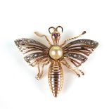 Yellow gold diamond, ruby and pearl bug brooch, tests 18 ct. Pearl measures 6 mm in diameter.