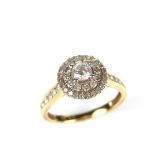 18 ct yellow gold diamond target ring. The central round brilliant cut diamond weighing approx. 0.