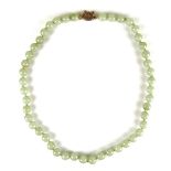 Jade bead necklace. The well matched circular jade beads measuring approx.