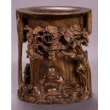 A Chinese Carved Elm Brush Pot, 20th Century. Dimensions: h: 9 1/2 x dia: 8 1/2 in.