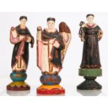 A Group of Three Carved Hardwood Santos Figures with Polychrome Decoration, Early 20th Century.