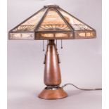 An Arts and Crafts Hammered Copper Table Lamp with a Faceted Eight Panel Slag Glass Shade, 20th