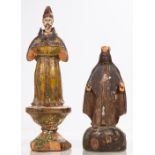 Two Carved Hardwood Santos Figures with Polychrome Decoration, 19th/20th Century. Largest