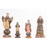 A Group of Four Carved Hardwood Santos Figures with Polychrome Decoration, 19th/20th Century.