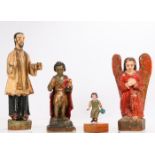 A Group of Four Carved Hardwood Santos Figures with Polychrome Decoration, 20th Century. Largest