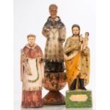 A Group of Three Carved Hardwood Santos Figures with Polychrome Decoration, 19th/20th Century.