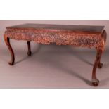 A Chinese Heavily Carved and Stained Hardwood Console Table, 20th Century. Dimensions: h: 34 x w: 31