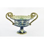 Coppa in maiolica con decori a fondo blu e manici a serpente , Molaroni Pesaro ,inizio XX sec.H.21,5