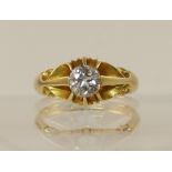 An 18ct gypsy set diamond solitaire ring the diamond of approximately 0.70cts claw setting