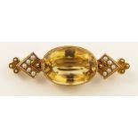 A 15ct Victorian brooch  set with an oval cut citrine and split pearls.