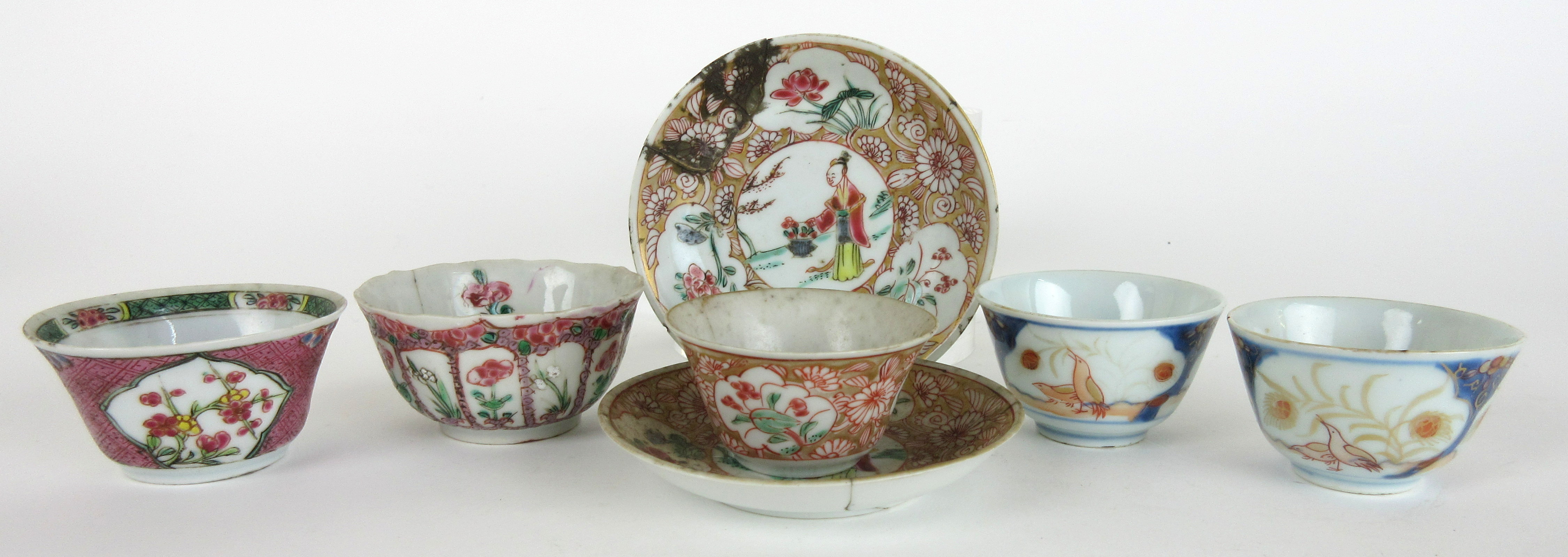 A pair of Chinese Imari tea bowls painted with birds and foliage, 6cm diameter, two gold ground