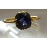 A sapphire ring set in bright yellow gold, the cushion shaped sapphire of approx 1.5cts has good