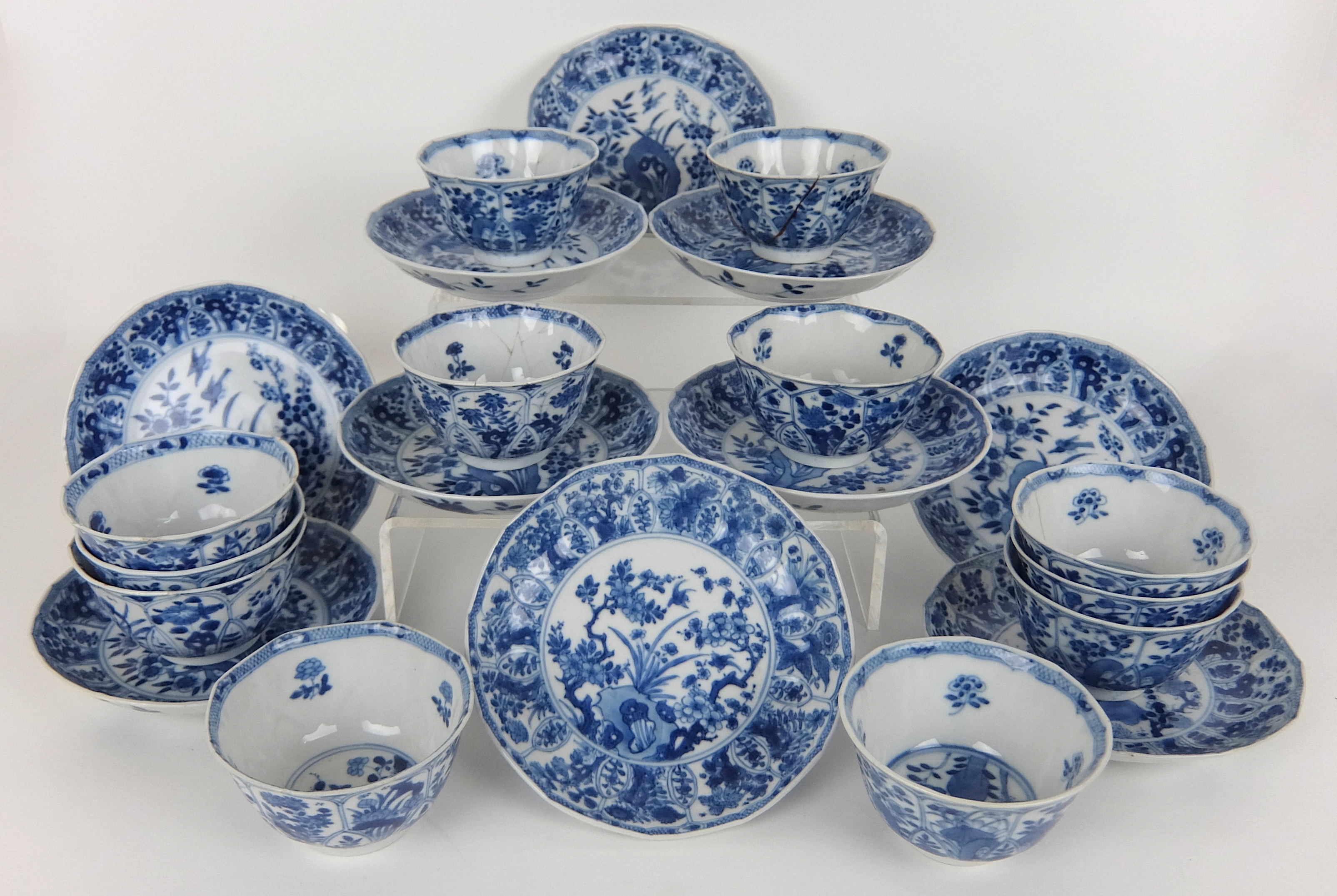 A set of twelve Chinese blue and white lobed teabowls and ten matching saucers painted with