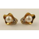 A pair of 18ct  Pearl and diamond earrings set with pearls of approx 6.6mm with diamond accents.