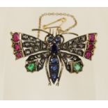 A Victorian butterfly brooch in yellow and white metal, the body set with sapphires and the