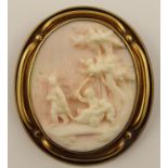 A European style pink and white cameo depicting children playing with a cart, in a yellow metal