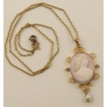 A pink and white shell cameo  of a maiden in profile, in 9ct scrolled mount set with a blister pearl