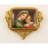 A substantial Italian style Victorian brooch with a porcelain plaque of the Madonna and child, in