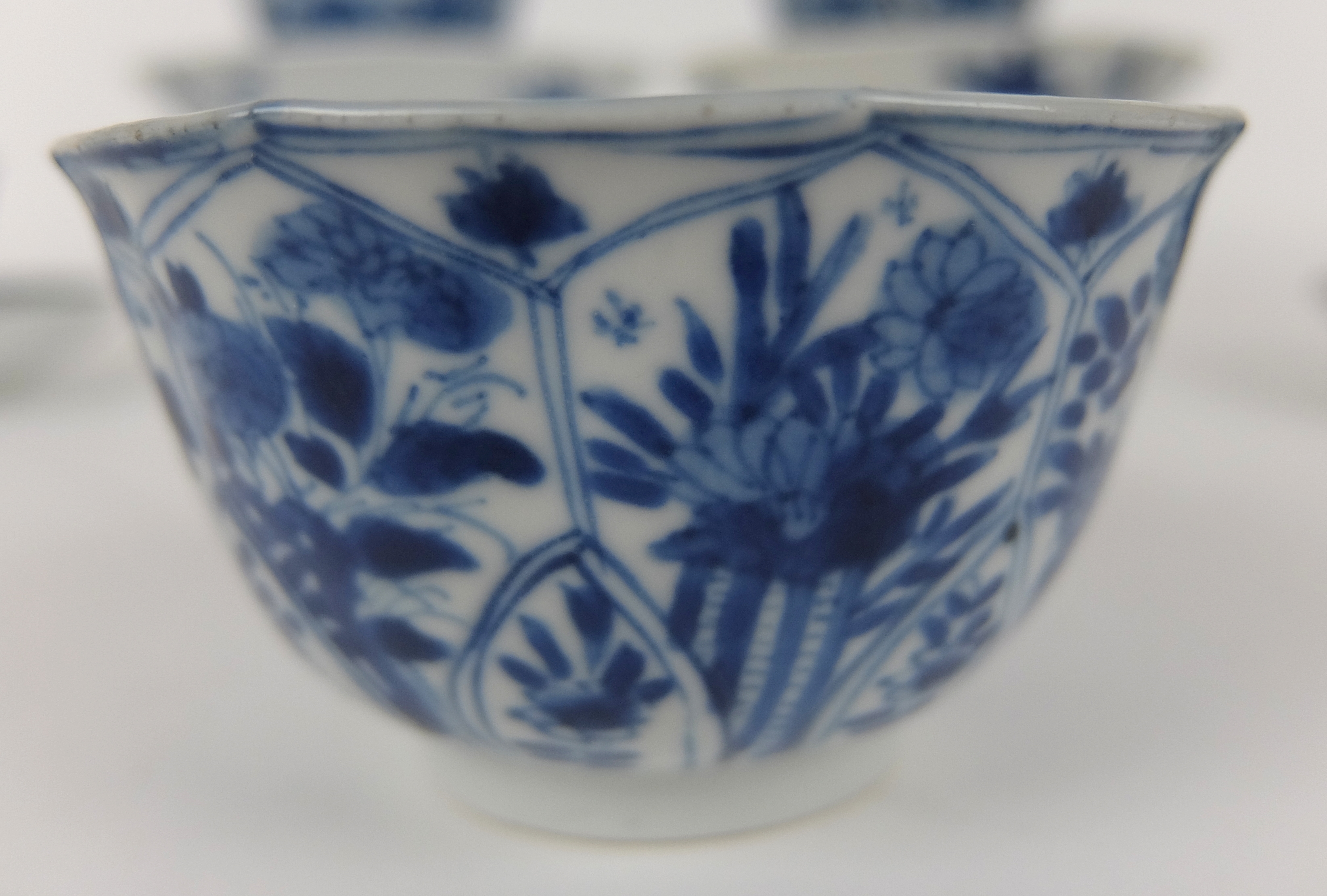 A set of twelve Chinese blue and white lobed teabowls and ten matching saucers painted with - Image 10 of 11