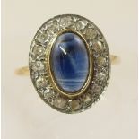 A 9ct blue gemstone cabouchon and diamond ring