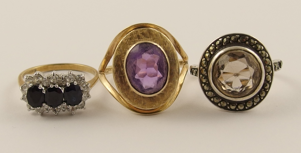 A 9ct retro amethyst set ring and two other gem set rings