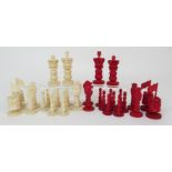 A Cantonese ivory chess set the King and Queen carved with pierced crown above double baluster