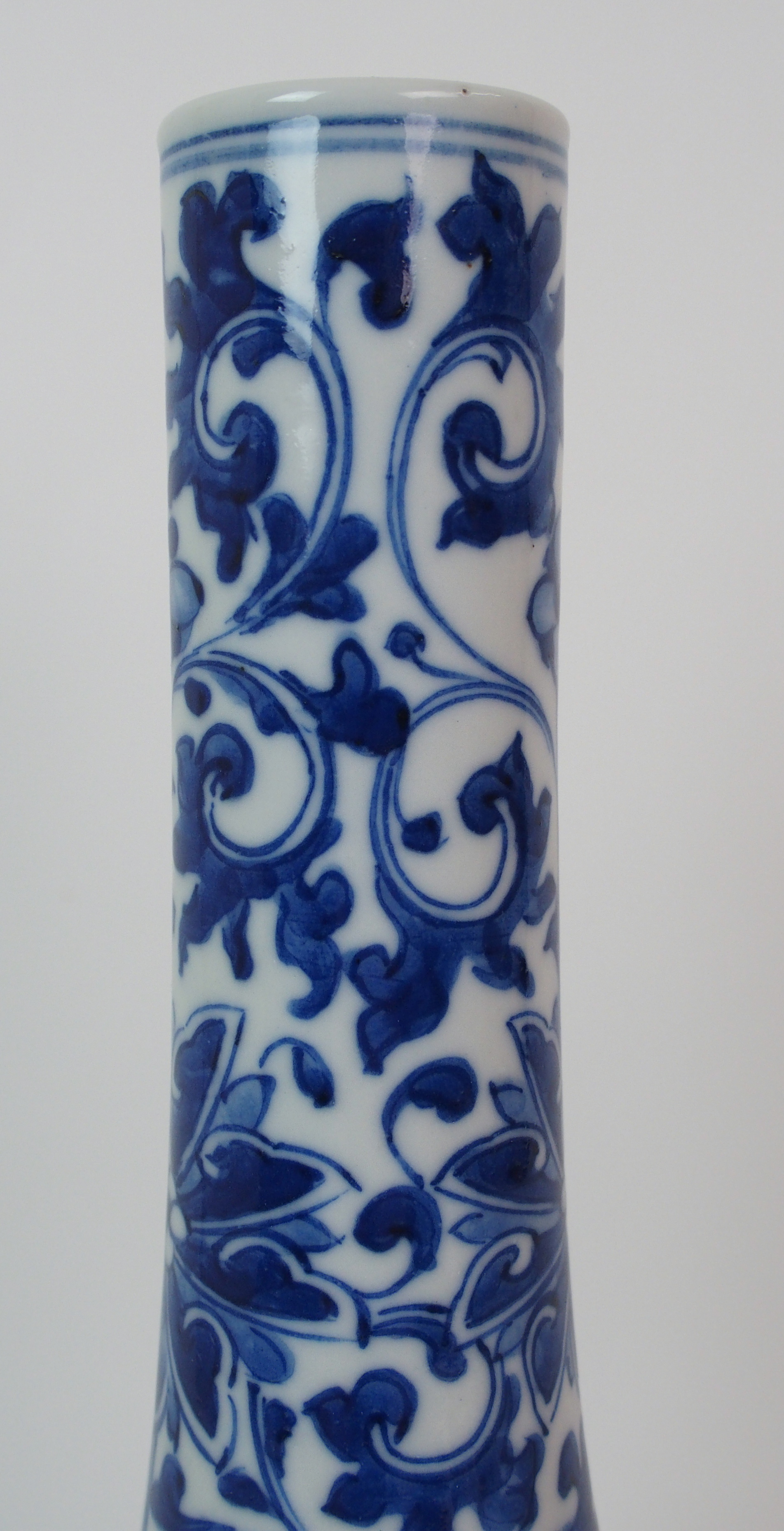 A Chinese blue and white bottle shaped vase painted with peonies and scrolling foliage, blue - Image 3 of 10