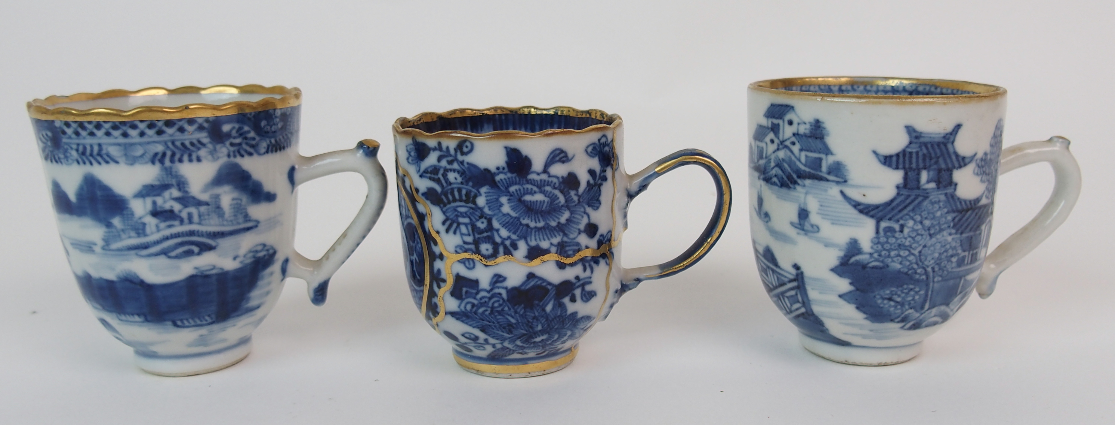 A group of twenty-three Chinese export teacups painted with typical landscapes and gilt rims, - Image 4 of 10