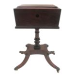 A George IV mahogany and ebony strung rectangular sewing table enclosing three divisions on multi-
